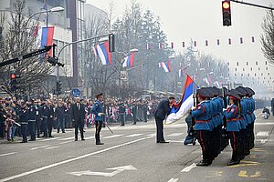 Milorad Dodik kissing the flag of Republika Srpska before the 2018 Republic Day parade in Banja Luka